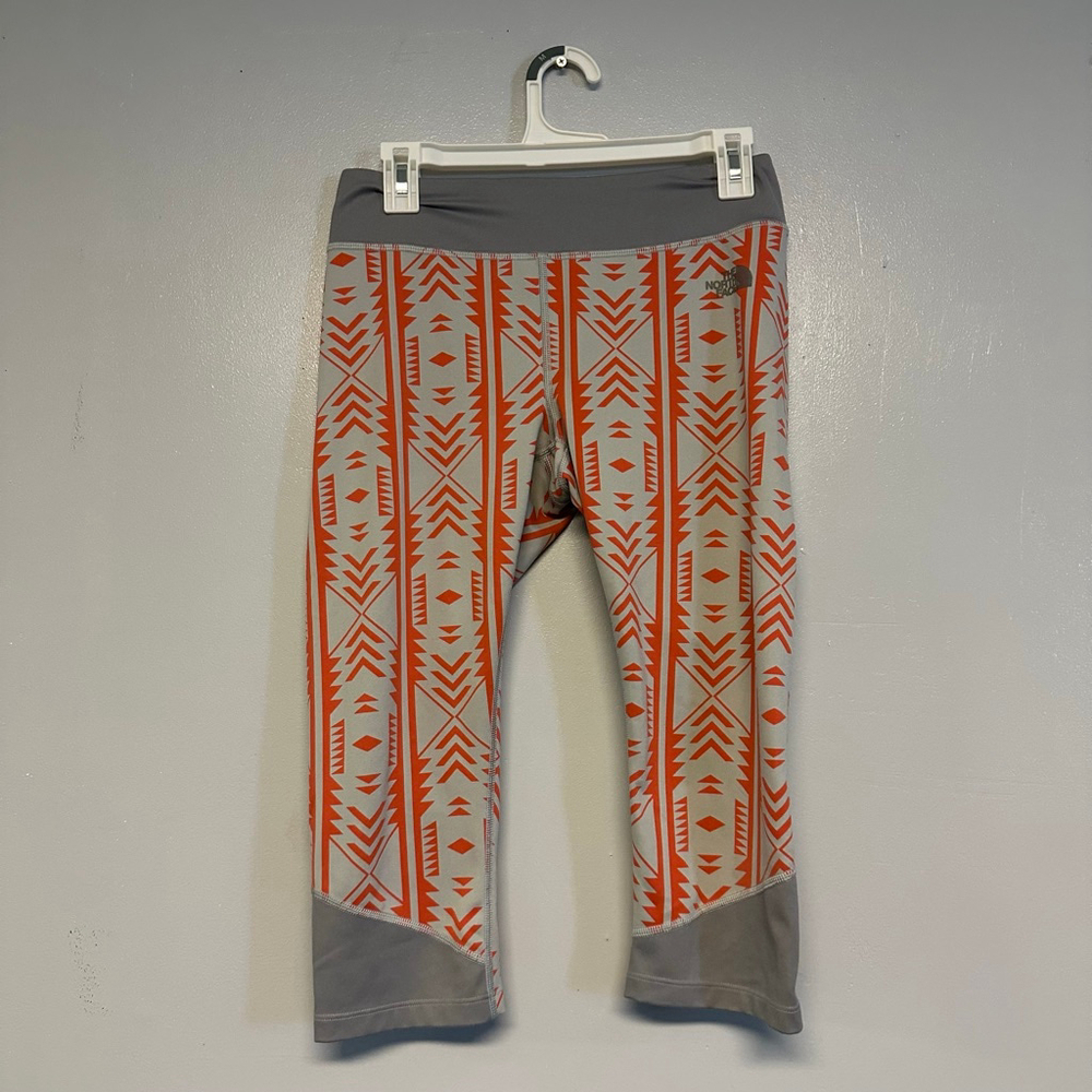 The North Face women’s Medium Orange Gray Patterned Leggings athletic cropped